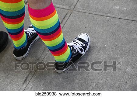 Stock Photo - Person wearing rainbow socks. Fotosearch