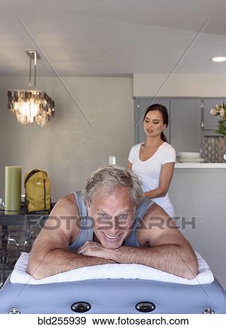 Physical therapist massaging man View Large Photo Image Stock Photo - Physical therapist massaging man. Fotosearch