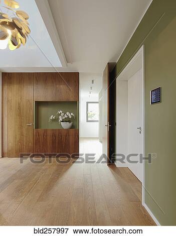 Stock Photo - Plank floor and walnut wall covering in home. Fotosearch