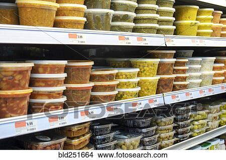 Plastic containers of food on supermarket shelves View Large Photo Image Picture - Plastic containers of food on supermarket shelves. Fotosearch