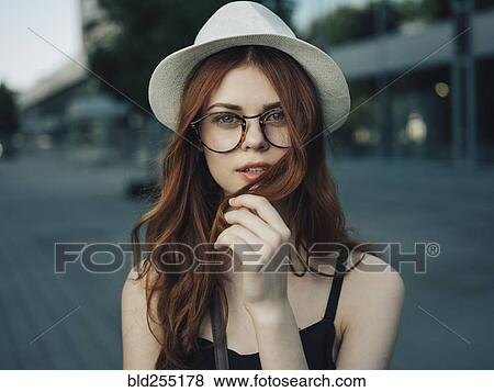 Stock Photo - Portrait of a Caucasian woman holding hair. Fotosearch