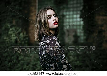 Portrait of a serious Caucasian woman outdoors View Large Photo Image Stock Photo - Portrait of a serious Caucasian woman outdoors. Fotosearch