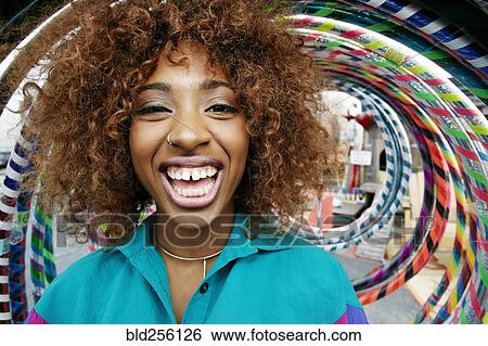 Portrait of black woman laughing near hoops View Large Photo Image Stock Photograph - Portrait of black woman laughing near hoops. Fotosearch