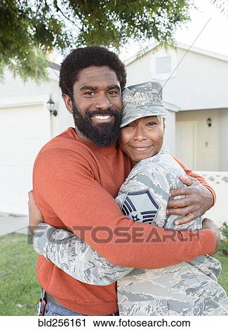 Portrait of black woman soldier hugging man View Large Photo Image Stock Image - Portrait of black woman soldier hugging man. Fotosearch