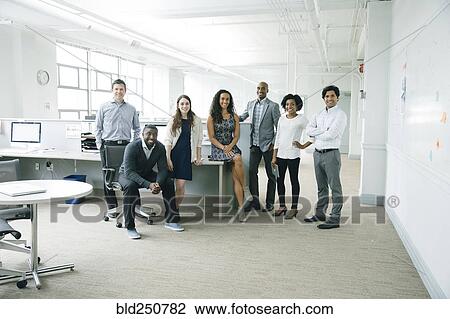 Stock Image - Portrait of business people in office. Fotosearch