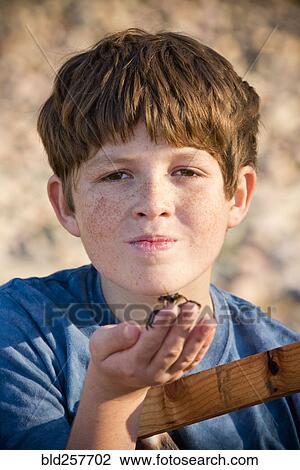 Portrait of Caucasian boy holding crab in hand View Large Photo Image Stock Image - Portrait of Caucasian boy holding crab in hand. Fotosearch