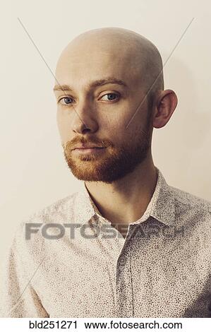 Stock Image - Portrait of Caucasian man with beard. Fotosearch