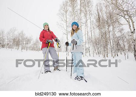 Portrait of Caucasian mother and daughter snowshoeing View Large Photo Image Stock Image - Portrait of Caucasian mother and daughter snowshoeing. Fotosearch