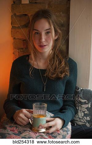 Portrait of Caucasian woman drinking beverage View Large Photo Image Stock Photo - Portrait of Caucasian woman drinking beverage. Fotosearch