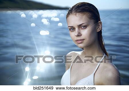 Stock Photo - Portrait of Caucasian woman in ocean. Fotosearch