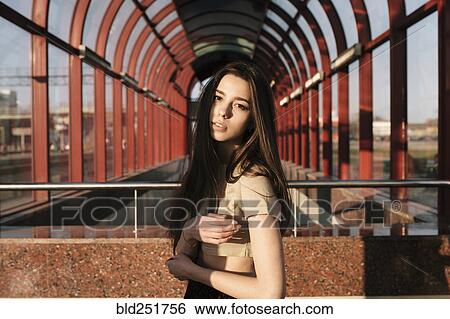 Portrait of Caucasian woman near arches outdoors View Large Photo Image Stock Photograph - Portrait of Caucasian woman near arches outdoors. Fotosearch