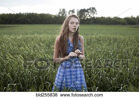 Portrait of Caucasian woman standing in field on farm View Large Photo Image Stock Photo - Portrait of Caucasian woman standing in field on farm. Fotosearch