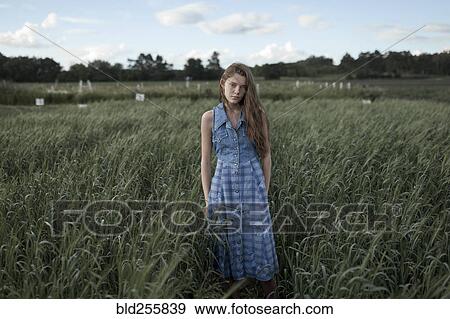 Portrait of Caucasian woman standing in field on farm View Large Photo Image Stock Photo - Portrait of Caucasian woman standing in field on farm. Fotosearch