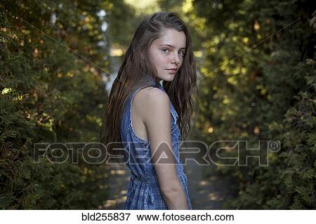 Portrait of Caucasian woman standing on path View Large Photo Image Stock Photo - Portrait of Caucasian woman standing on path. Fotosearch