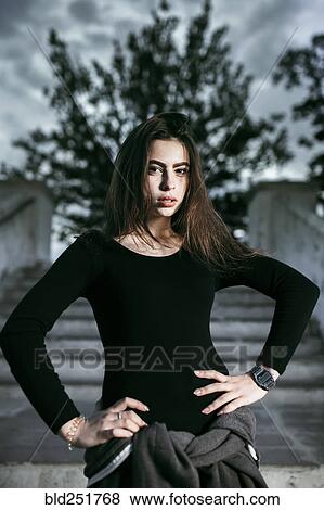 Stock Photo - Portrait of Caucasian woman with hands on hips. Fotosearch
