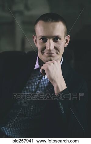 Stock Image - Portrait of confident Caucasian man. Fotosearch