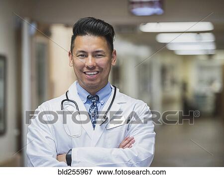Portrait of confident Filipino doctor View Large Photo Image Stock Photo - Portrait of confident Filipino doctor. Fotosearch