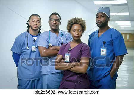 Stock Image - Portrait of confident nurses. Fotosearch
