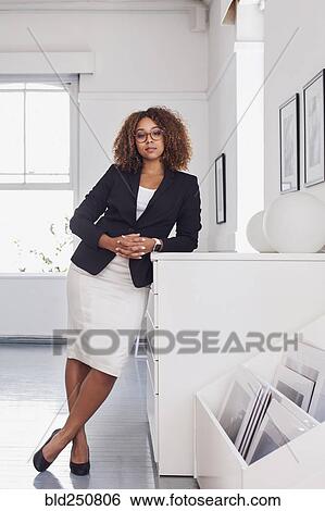 Portrait of mixed race woman in gallery View Large Photo Image Stock Photograph - Portrait of mixed race woman in gallery. Fotosearch