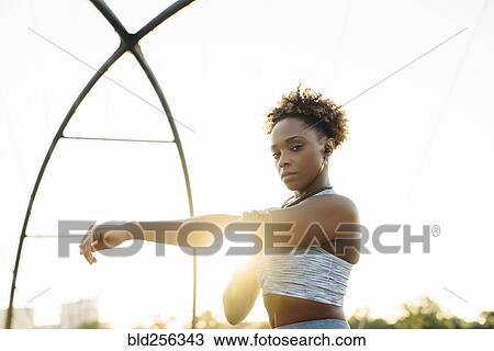 Portrait of mixed race woman stretching arms View Large Photo Image Stock Image - Portrait of mixed race woman stretching arms. Fotosearch