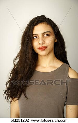 Stock Image - Portrait of mixed race woman with nose ring. Fotosearch