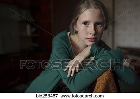 Portrait of pensive Caucasian woman leaning on chair View Large Photo Image Stock Photo - Portrait of pensive Caucasian woman leaning on chair. Fotosearch
