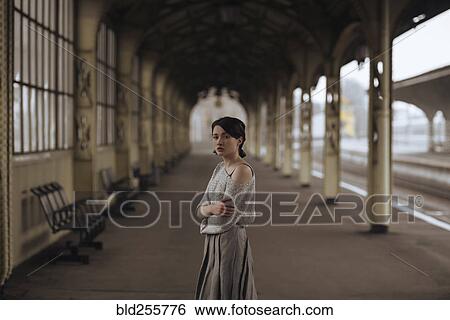 Portrait of serious Caucasian woman at train station View Large Photo Image Stock Photograph - Portrait of serious Caucasian woman at train station. Fotosearch