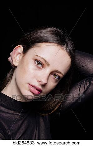 Portrait of serious Caucasian woman with hand in hair View Large Photo Image Stock Image - Portrait of serious Caucasian woman with hand in hair. Fotosearch