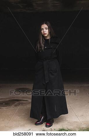 Portrait of serious Caucasian woman wearing black coat View Large Photo Image Stock Image - Portrait of serious Caucasian woman wearing black coat. Fotosearch