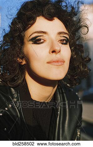 Stock Image - Portrait of serious Caucasian woman wearing mascara. Fotosearch