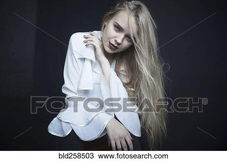Stock Image - Portrait of serious Caucasian woman. Fotosearch