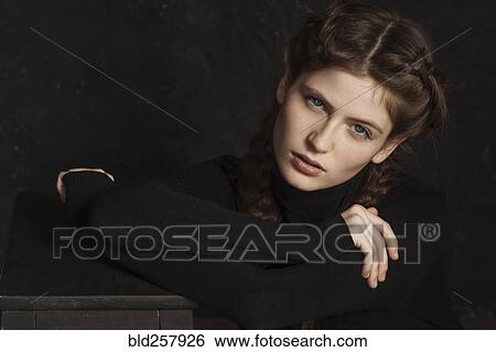 Stock Photograph - Portrait of serious Caucasian woman. Fotosearch