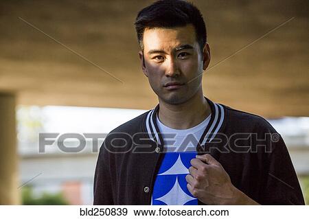 Stock Photo - Portrait of serious Chinese man. Fotosearch