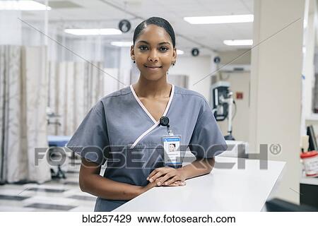 Portrait of smiling African American nurse in hospital View Large Photo Image Stock Photo - Portrait of smiling African American nurse in hospital. Fotosearch