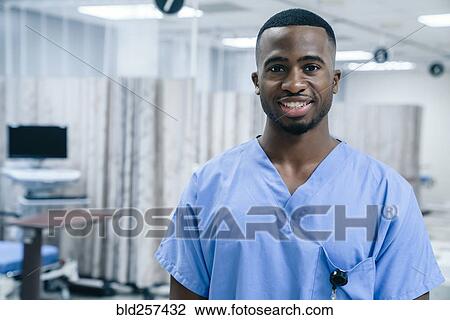 Stock Image - Portrait of smiling Black doctor in hospital. Fotosearch