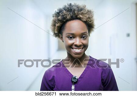Stock Image - Portrait of smiling black nurse. Fotosearch