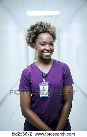 Stock Image - Portrait of smiling black nurse. Fotosearch