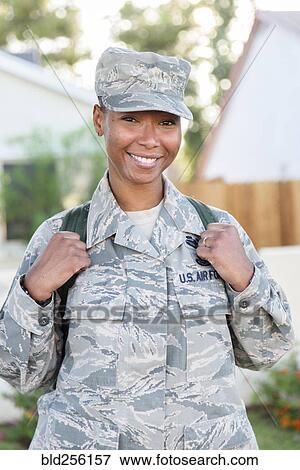 Stock Photo - Portrait of smiling black woman soldier. Fotosearch