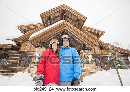 Picture - Portrait of smiling Caucasian couple on winter vacation. Fotosearch
