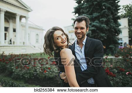 Portrait of smiling Caucasian couple hugging View Large Photo Image Picture - Portrait of smiling Caucasian couple hugging. Fotosearch