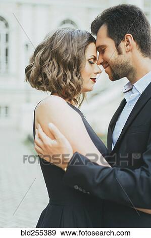 Portrait of smiling Caucasian couple hugging View Large Photo Image Stock Photo - Portrait of smiling Caucasian couple hugging. Fotosearch