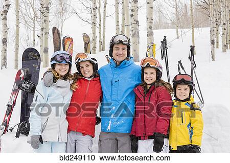 Portrait of smiling Caucasian family on skiing vacation View Large Photo Image Stock Image - Portrait of smiling Caucasian family on skiing vacation. Fotosearch