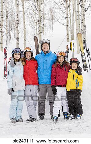 Portrait of smiling Caucasian family on skiing vacation View Large Photo Image Stock Image - Portrait of smiling Caucasian family on skiing vacation. Fotosearch
