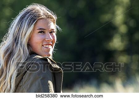 Stock Image - Portrait of smiling Caucasian girl. Fotosearch