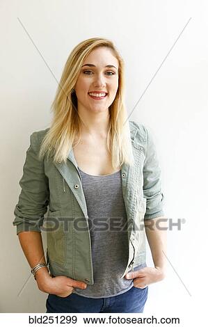 Stock Photo - Portrait of smiling Caucasian woman wearing jacket. Fotosearch