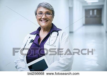 Portrait of smiling mixed race doctor View Large Photo Image Stock Photo - Portrait of smiling mixed race doctor. Fotosearch