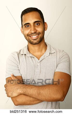 Stock Photograph - Portrait of smiling mixed race man. Fotosearch