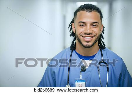 Stock Photo - Portrait of smiling mixed race nurse. Fotosearch