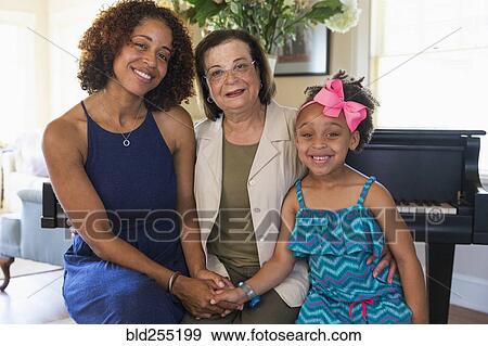 Portrait of smiling mixed race multi-generation family View Large Photo Image Stock Photo - Portrait of smiling mixed race multi-generation family. Fotosearch
