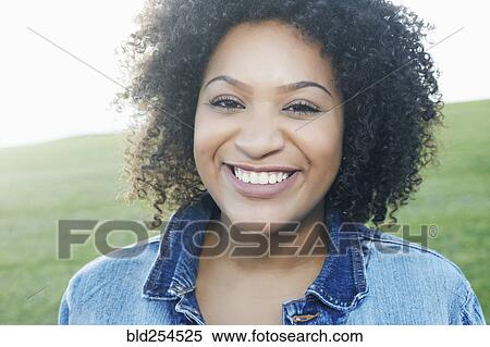 Stock Photography - Portrait of smiling mixed race woman. Fotosearch